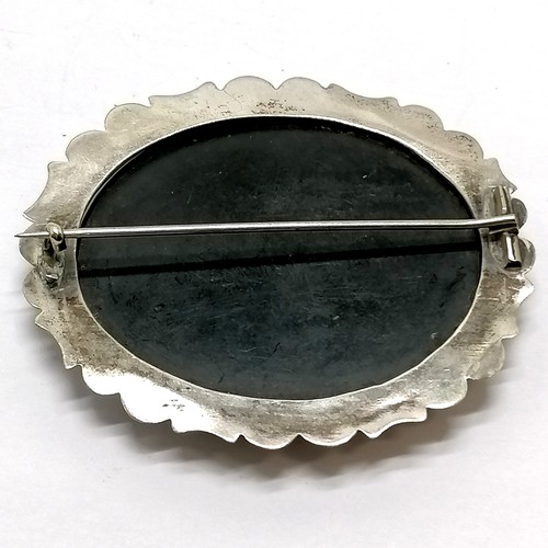 512 - Antique pietra dura panel brooch in unmarked silver mount - 6.5cm across ~ signs of wear & slight lo... 