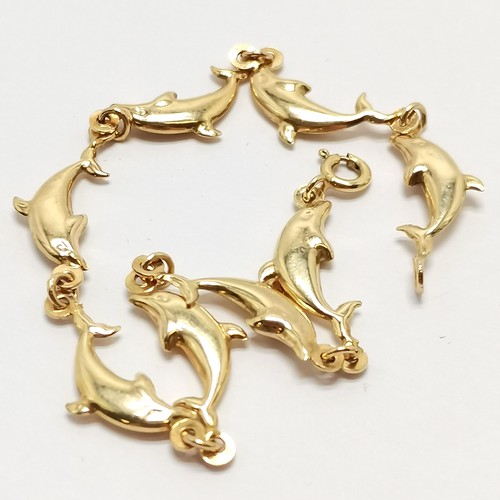 521 - 9ct marked gold dolphin link bracelet - 8cm & 2.7g