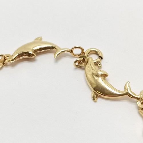 521 - 9ct marked gold dolphin link bracelet - 8cm & 2.7g