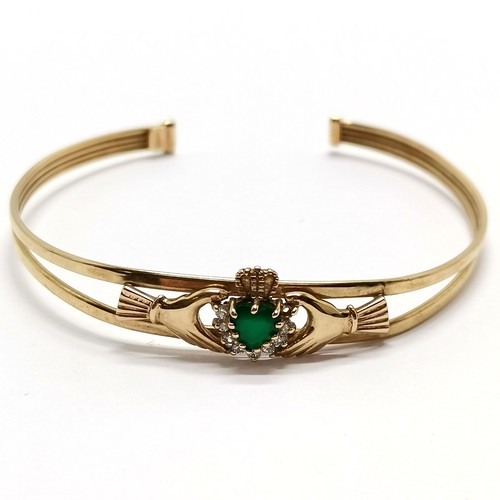 524 - 9ct hallmarked gold claddagh bangle set with heart shaped emerald & white stones (1 missing) - 5.2g ... 