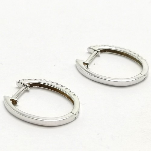 532 - Pair of 18ct marked white gold diamond stone set hoop earrings - 1.5cm drop & 1.5g total weight