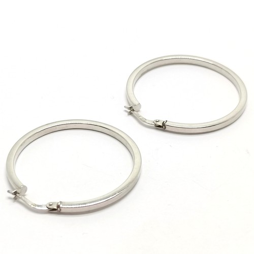 547 - Pair of 9ct hallmarked white gold hoop earrings - 4cm diameter & 1.9g