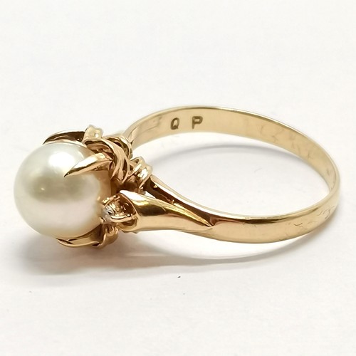 575 - 18ct marked gold pearl set ring with diamond set shoulders - size N & 3.8g total weight