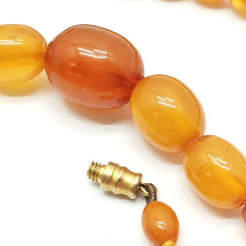 590 - Strand of graduated amber beads - 42cm long & 15.8g total weight ~ larger have slight chips