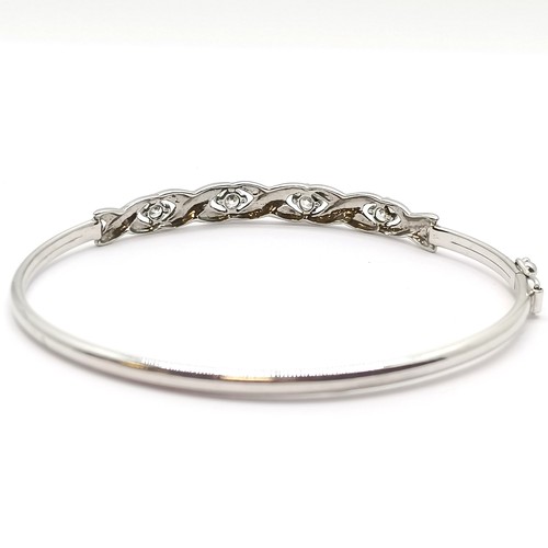 628 - 9ct hallmarked white gold bangle set with 5 CZ stones  - 6cm & 4.5g total weight