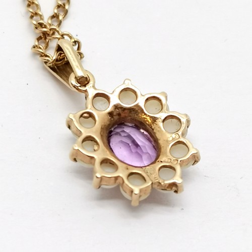 683 - 9ct hallmarked gold amethyst / pearl pendant on a 9ct marked gold 50cm chain - 4.8g total weight