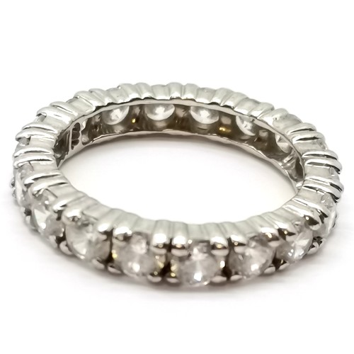 714 - Unmarked white gold white stone set eternity ring by T♢D - size O & 3.7g total weight