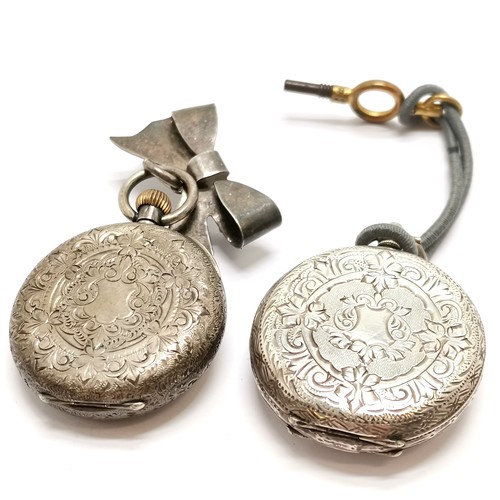 731 - 2 x antique silver cased ladies fob watches (smallest 32mm diameter & has silver bow to top) - total... 