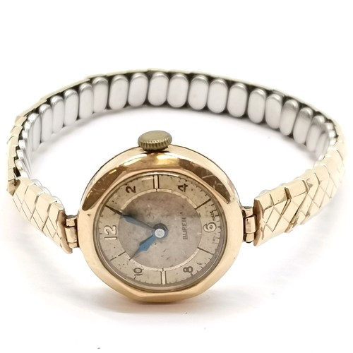 743 - 9ct gold (20mm) cased Buren ladies vintage wristwatch on a stretchy gold plated bracelet (17.7g tota... 