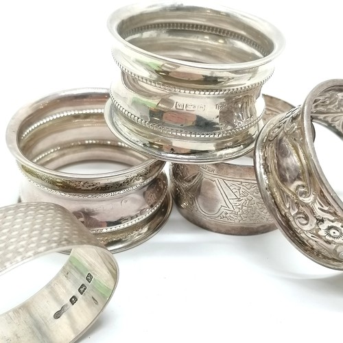 762 - 5 x silver marked napkin rings inc beaded decorated undedicated pair ~ 70g t/w pair of glass knife r... 