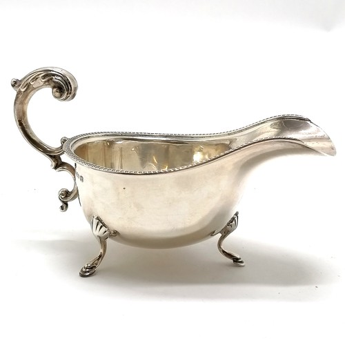 765 - 1936 silver hallmarked gravy boat terminating on 3 hoof feet by S Blanckensee & Son Ltd - 17cm acros... 