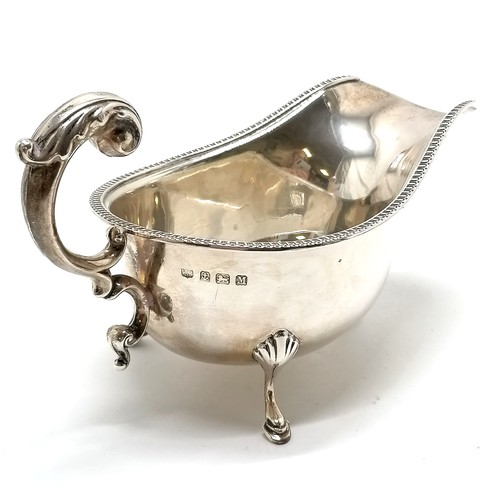 765 - 1936 silver hallmarked gravy boat terminating on 3 hoof feet by S Blanckensee & Son Ltd - 17cm acros... 