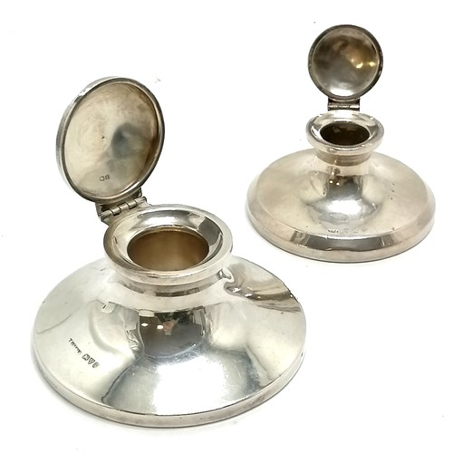 773 - 2 x silver capstan inkwells - largest Chester hallmark 9.5cm diameter ~ both have dents & lack liner... 