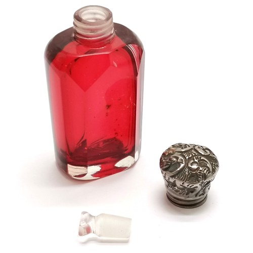 781 - Antique cranberry glass scent bottle with unmarked silver embossed lid - 6cm high & no obvious damag... 