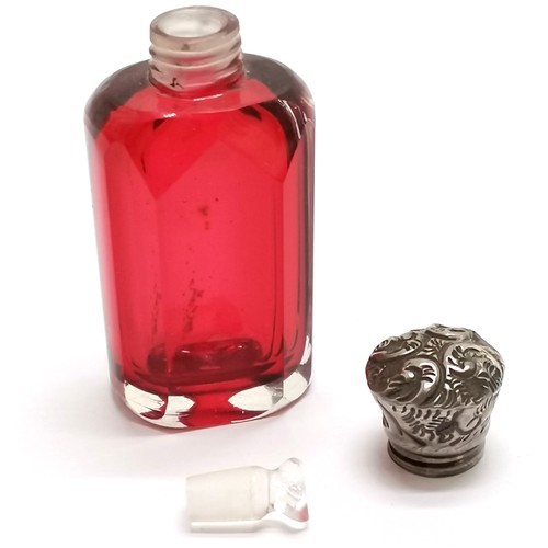 781 - Antique cranberry glass scent bottle with unmarked silver embossed lid - 6cm high & no obvious damag... 