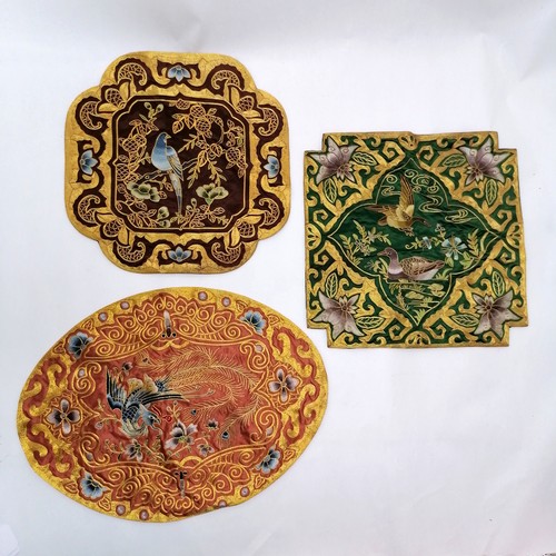 30 - 3 Oriental embroidered silk placemats depicting birds, largest oval 43cm x 33cm