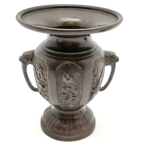 32 - Oriental bronze 2 handled vessel with elephant trunk handles 15cm high x 11cm diameter, spelter seat... 