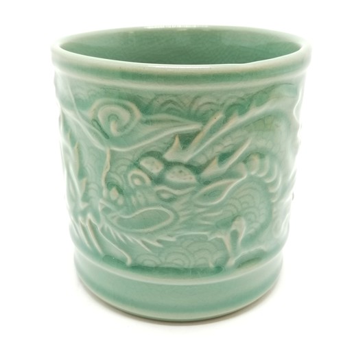 36 - Oriental crackle green glaze cylindrical pot with dragon detail - 11.5cm diameter x 11.5cm high with... 