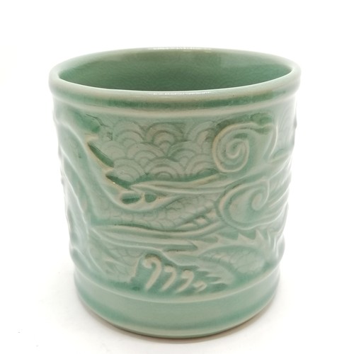 36 - Oriental crackle green glaze cylindrical pot with dragon detail - 11.5cm diameter x 11.5cm high with... 