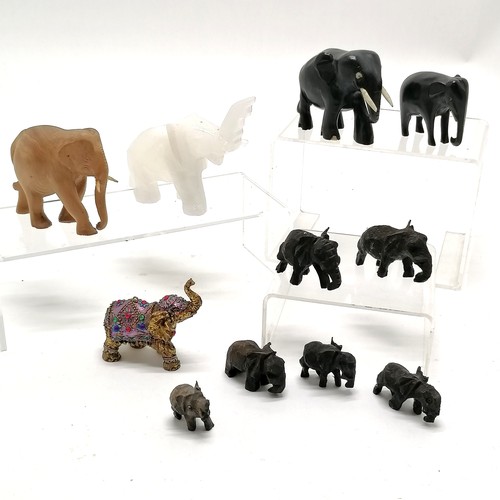 43 - Qty of elephant figures inc hand carved ebony, onyx (8cm total height), sandalwood etc - some a/f