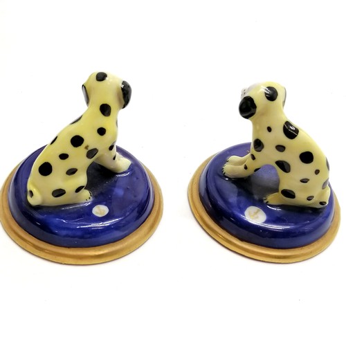 44 - Pair of miniature porcelain dalmatian dogs with gold anchor marks (4.4cm diameter), carved German wo... 