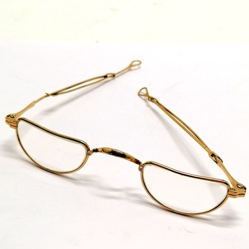 59 - Antique gold plated pair of reading spectacles with extending arms by Luna (Germany) - 12cm across