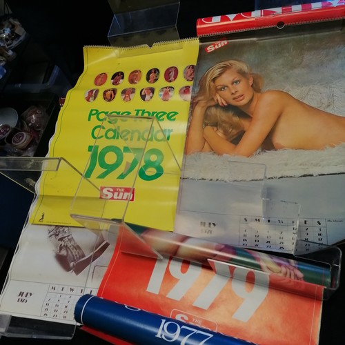 67 - Large collection of The Sun calendars dating from 1975 to 2007 ~ have mostly all been rolled up and ... 