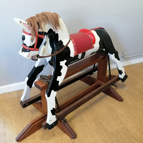 86 - Peter the Piebald rocking horse on mahogany base with vinyl saddle, in good used condition 145cm lon... 