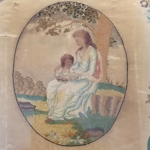 93 - Antique oval framed needlework picture of mother and child with a border of flowers frame size 50cm ... 