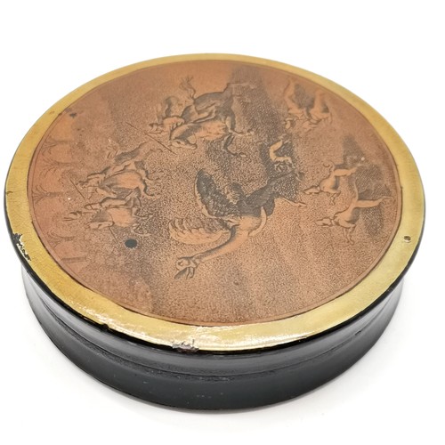 153 - Antique papier-mâché circular snuff box depicting an emu being hunted to the lid 9cm diameter, some ... 