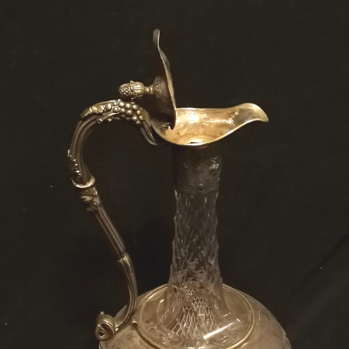 158 - Victorian cut glass claret jug with silver plated mounts with pineapple finial and etched grape vine... 