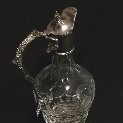 159 - Cut glass claret jug with silver plated mounts with vine leaf decoration 27cm high - no obvious dama... 