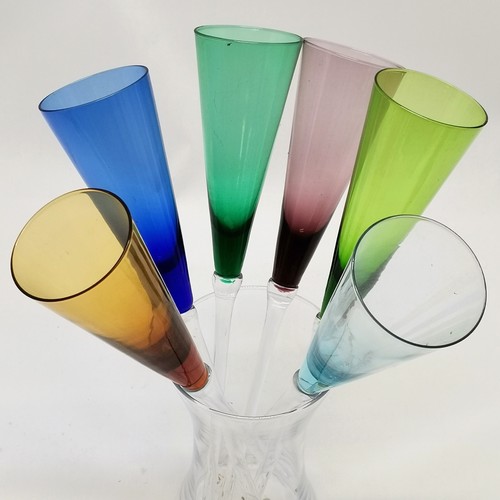 167 - Set of 6 coloured glass flutes 32cm long in a glass container- no obvious damage