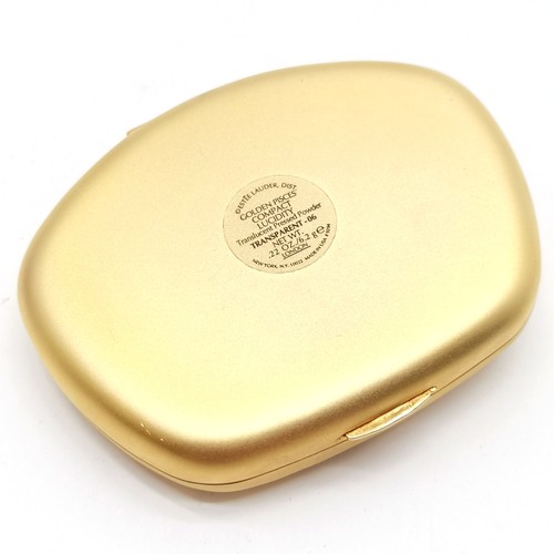 184 - Estee Lauder Pisces gold tone powder compact in original retail packaging - in unused condition but ... 