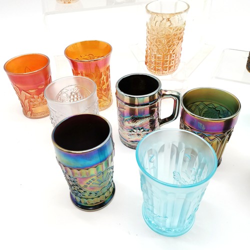 185 - Collection of assorted Carnival glass beakers of varying colours, largest being 11 cm high inscribed... 