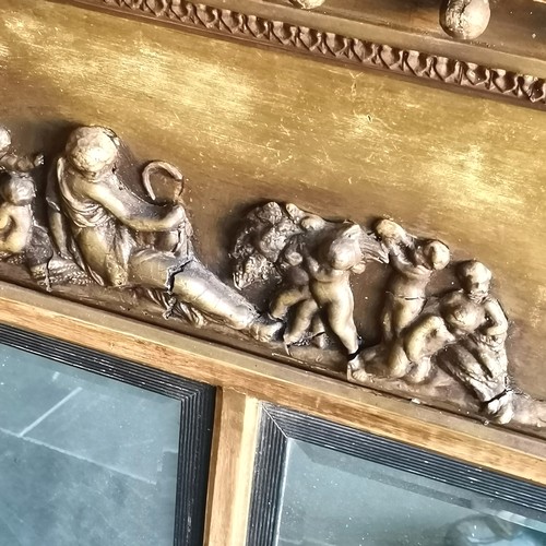 201 - Classical decorated gilt framed over mantle mirror, 128 cm wide, 93 cm high.