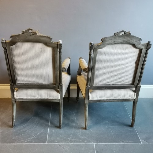 202 - Pair of French painted salon chairs with a striped upholstery, in used condition, 62 cm wide, 64 cm ... 