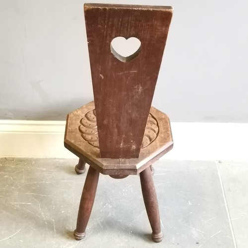 215 - Antique carved oak high backed spinning chair with heart detail measuring 36cm x 38cm x 89cm. Used c... 