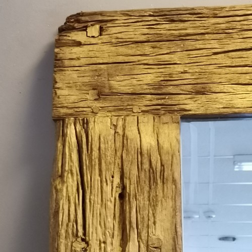 223 - Large driftwood framed bevelled edge mirror measuring 100cm wide x 200cm high.