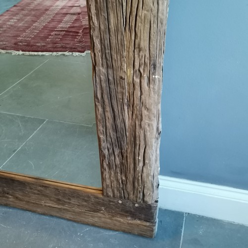 225 - Driftwood bevelled edged framed mirror measuring 100cm wide x 120cm high. In good condition.