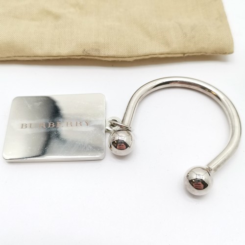 299 - Burberry steel keys fob (in original bag), gilt metal coin purse (10cm x 6cm) & unusual Estyma penda... 