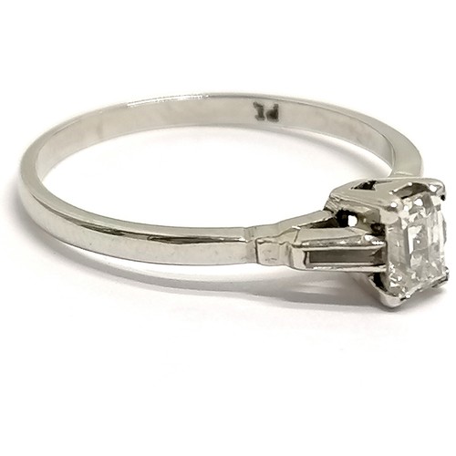 573 - Platinum baguette diamond set ring with diamond set shoulders - size K & 2g total weight