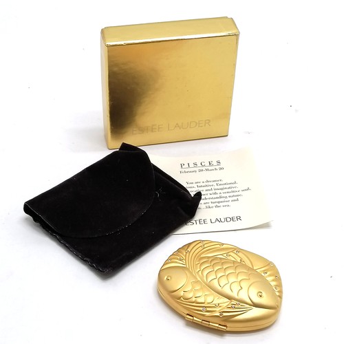 184 - Estee Lauder Pisces gold tone powder compact in original retail packaging - in unused condition but ... 