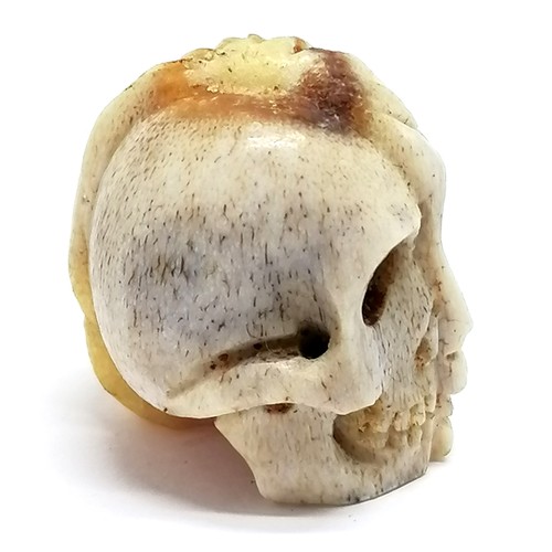 193 - Antique carved bone memento mori (2cm) t/w 3 x vegetable root votives & crucifix