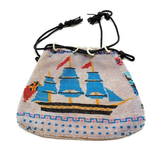 195 - Antique Berlin beadwork purse depicting tall masted ship & has drawstring to top (with mother of pea... 
