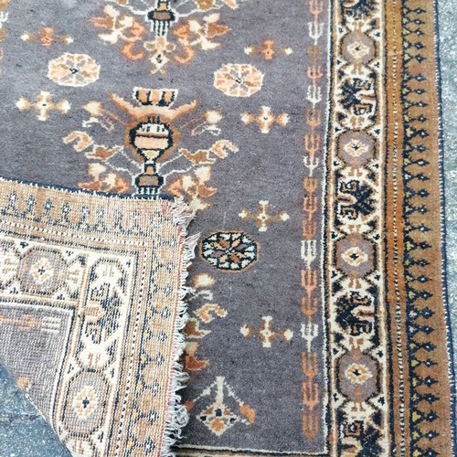 216 - Hand woven small eastern orange grounded rug with geometric pattern - 100cm x 75cm ~ wear to the fri... 