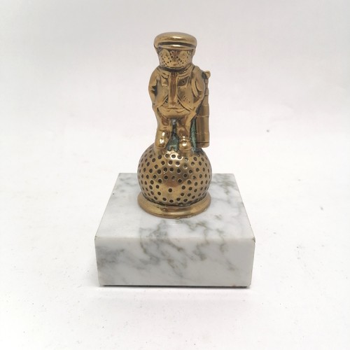 223 - Tubal Cain products brass mascot of a golfer mounted on a white marble base - 12cm high