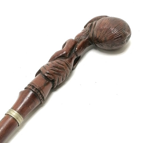 224 - Antique hand carved walking stick / parasol handle in the form of a promenading lady - total length ... 