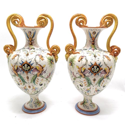 236 - Pair of large Italian Majolica vases with serpent scroll detail handles and profusely hand decorated... 