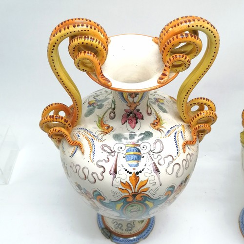 236 - Pair of large Italian Majolica vases with serpent scroll detail handles and profusely hand decorated... 